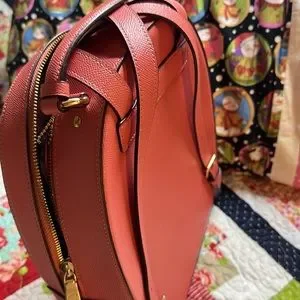 Beautiful Salmon colored Coach backpack. Never used, still has tags attached. i have become that person that brings her kindle everywhere  main image 3